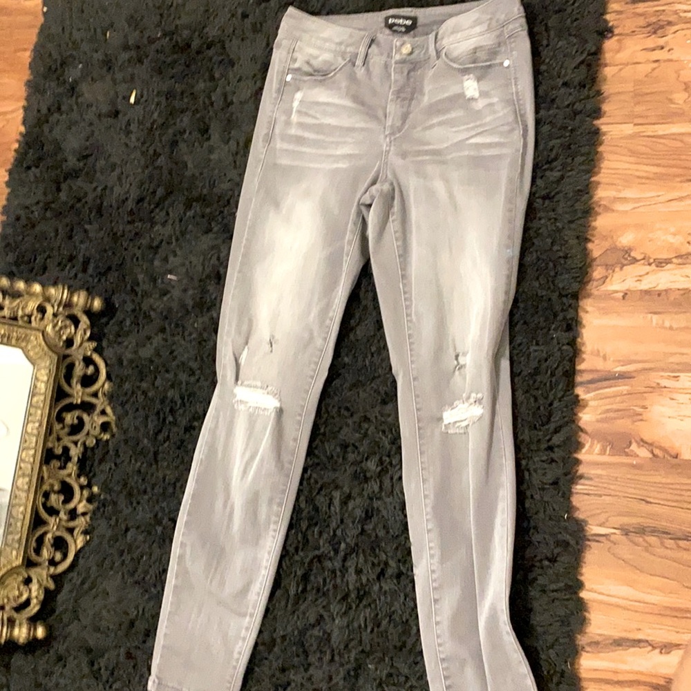 Gray women’s jeans size 28 and the brand is Bebe